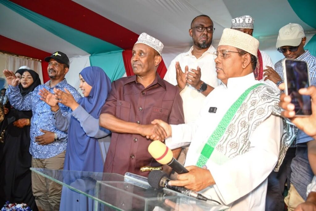 Governor Ali Bunow Korane (left) and Mohamed Moulid Shurie shake hands after Shurie endorsed Korane's 2027 gubernatorial bid and conceded the contest.