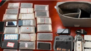 JKIA cleaner arrested carrying bags containing 52 smartphones, three drones